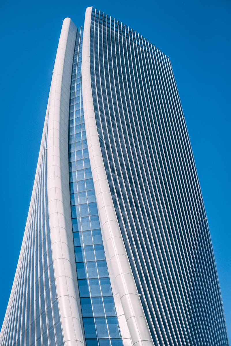 Photo by Davide Pietralunga photo of white high-rise building